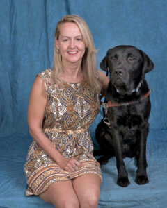 Graduate Amy and black Lab guide Elvin
