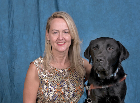 Graduate Amy and black Lab guide Elvin