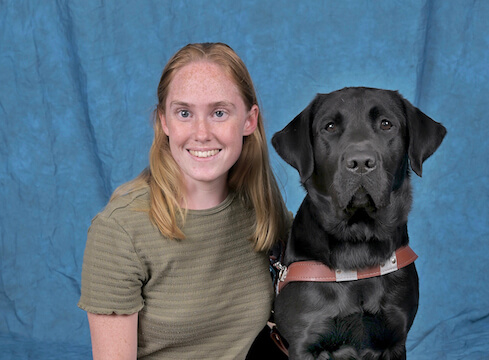 Graduate Elexis and black Lab guide Waldo