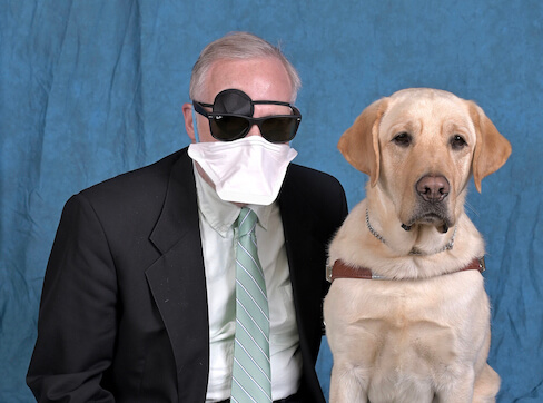 Graduate Marc and yellow Lab guide Rooney
