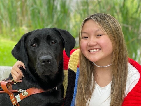 Graduate Sydney and black Lab guide Vaughn