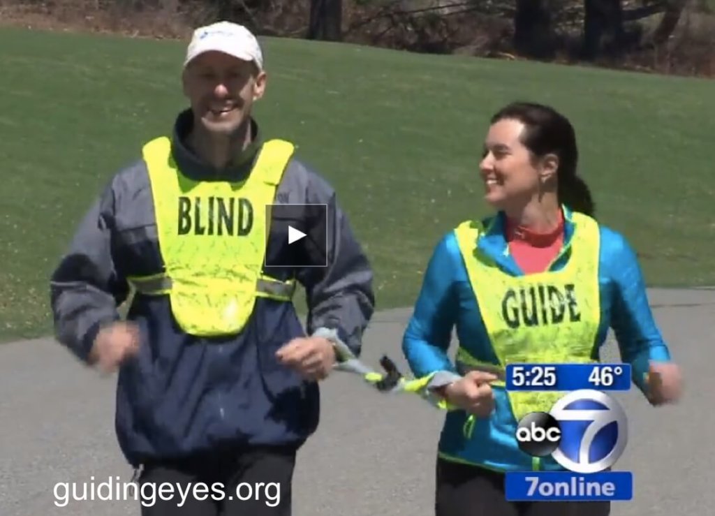 ABC7 reporter Amy Freeze acts as a sighted guide for Guiding Eyes CEO Tom Panek