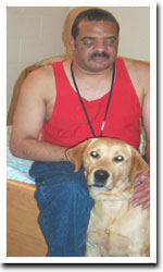 Man in red t-shirt with yellow lab