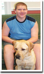 Boy with yellow lab