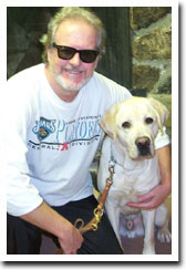 Man posing with white lab