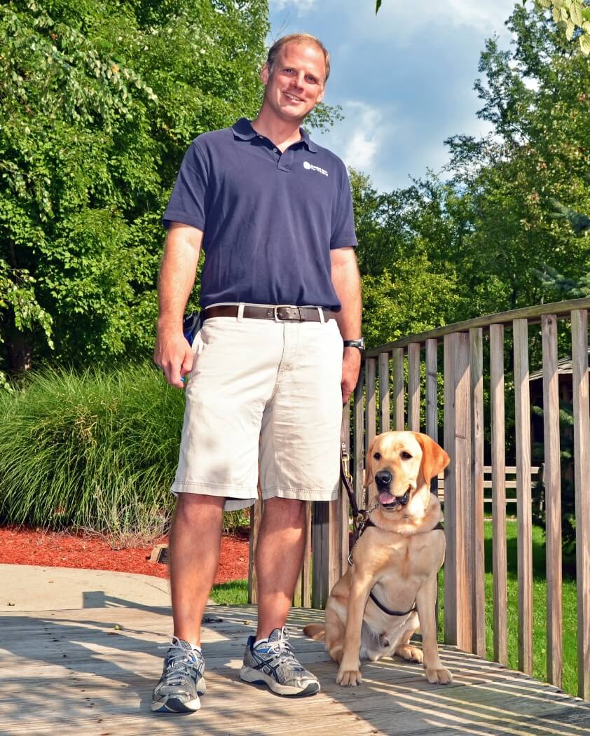 Training supervisor Gerald Brenninkmeyer with a Guiding Eyes dog in training