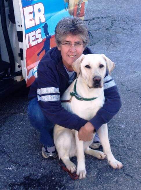 Lee Nordin and yellow Lab Link