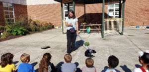 Sharon and black lab puppy April visit with a local elementary school to talk with the 2nd grade class about service animals. One of the students in the class was blind and the school wanted to help the class understand how a service dog learns commands.