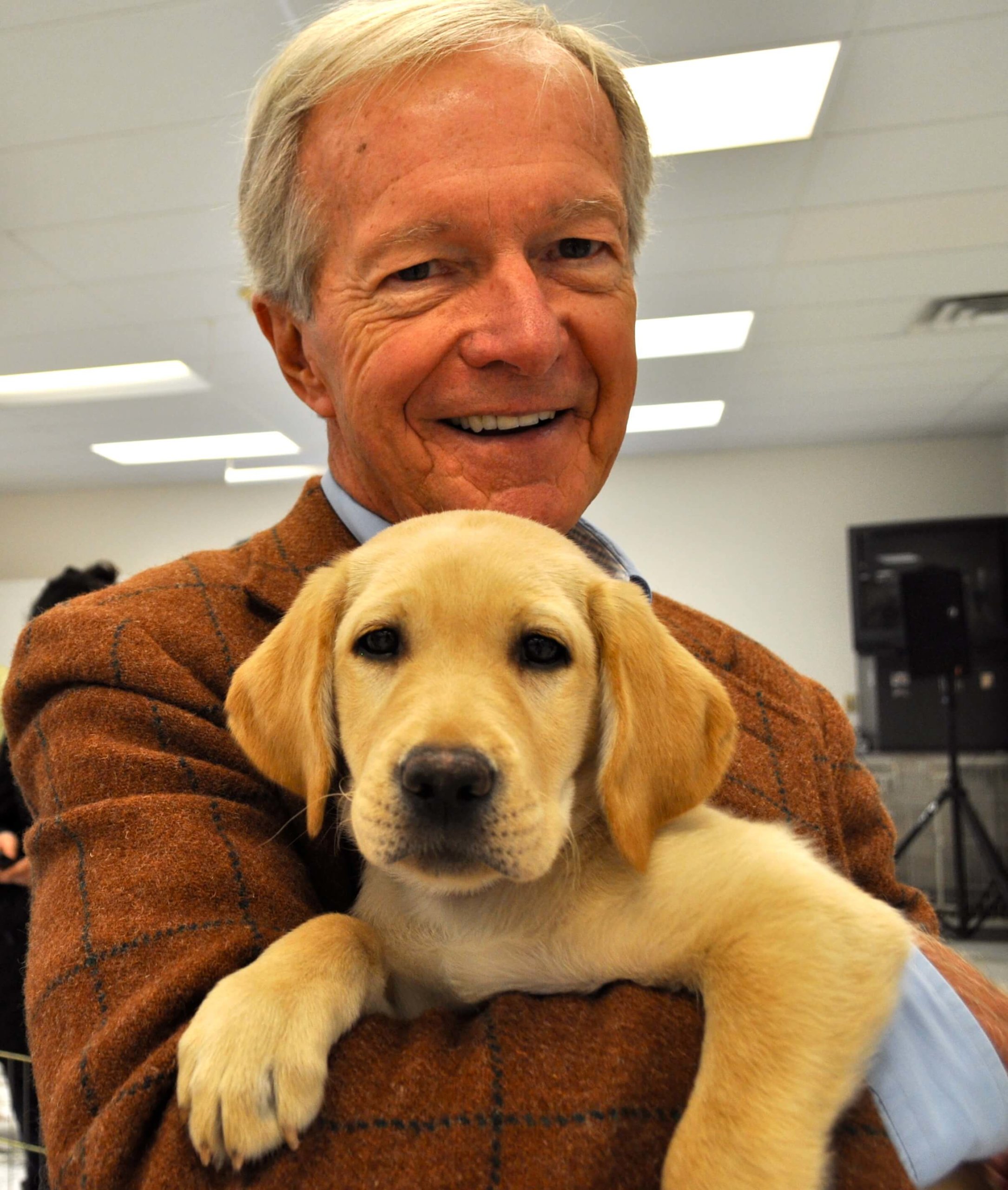 Bill Badger with a Guiding Eyes puppy 