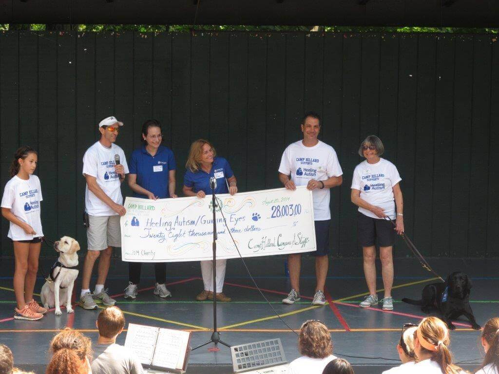 Camp Hillard presents check to Guiding Eyes' Heeling Autism Program