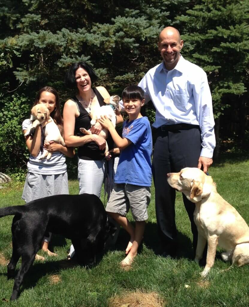The Panek family with guide dog Gus, pet dog Onyx and future guide dogs Nimble and Nell