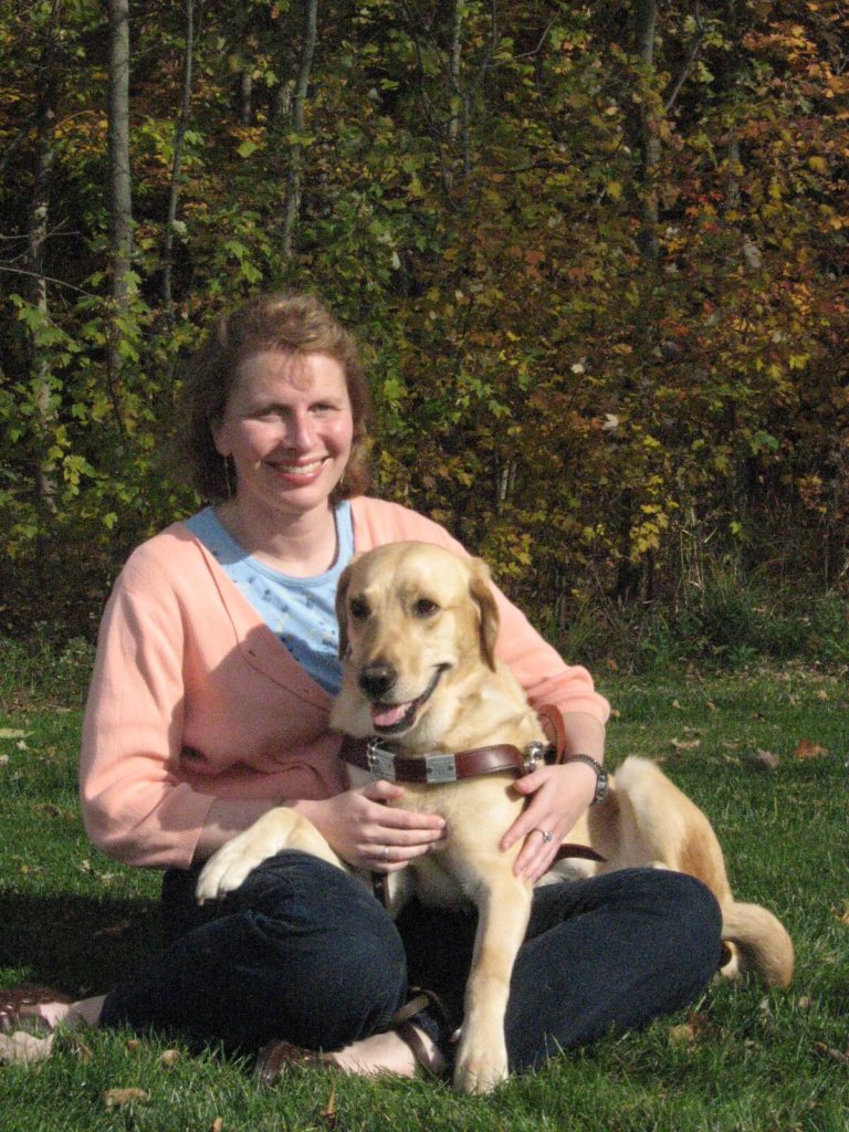 Grad Kathy Nimmer and yellow Lab guide dog Elias