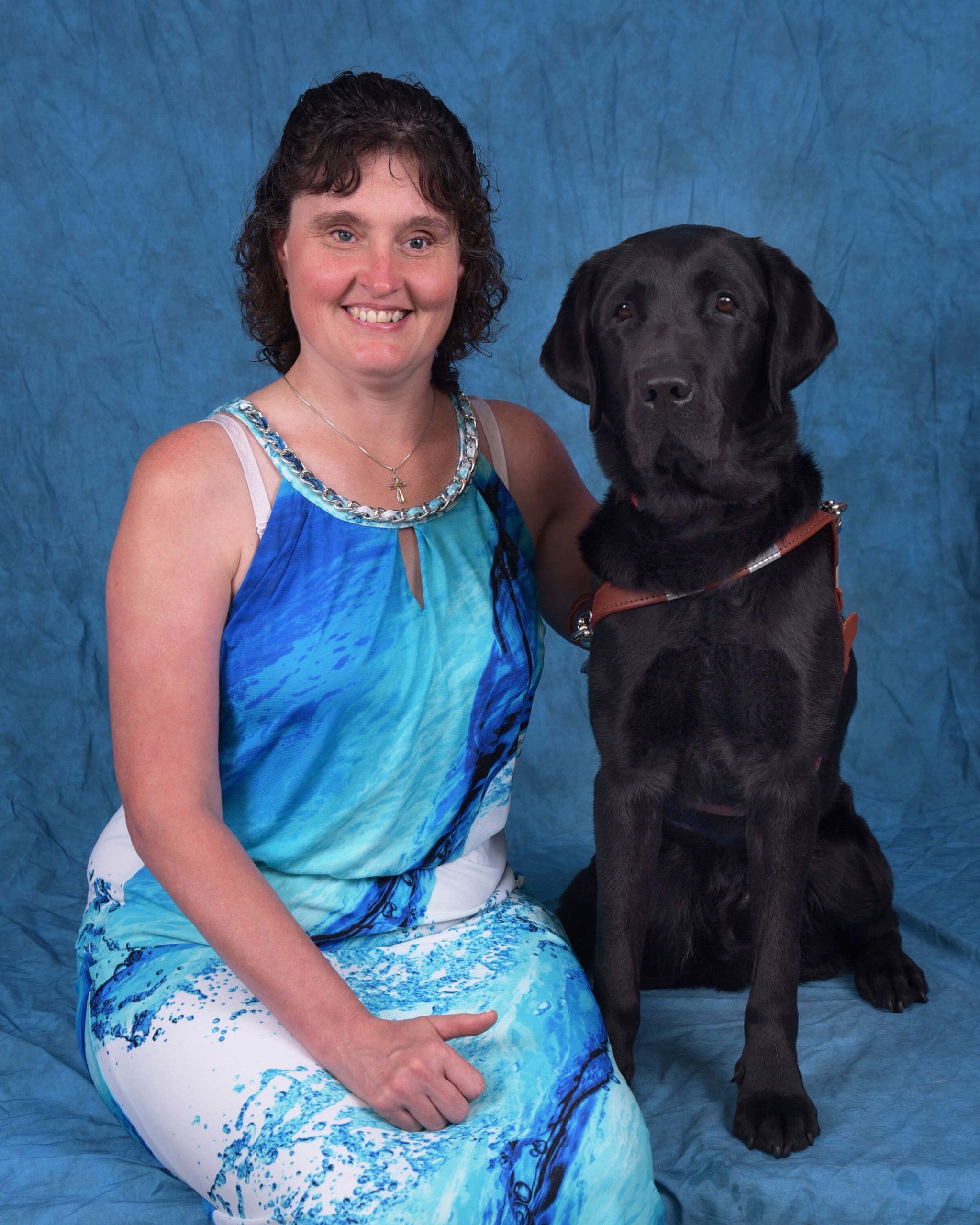 Graduation photo of July graduate Annee and guide dog Willis