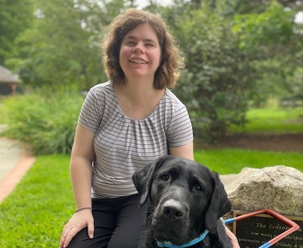 Graduate Ashley with guide dog Pendleton