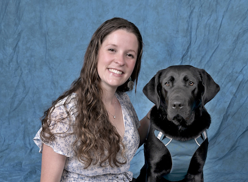 Graduate Ashley and black Lab guide Lolly