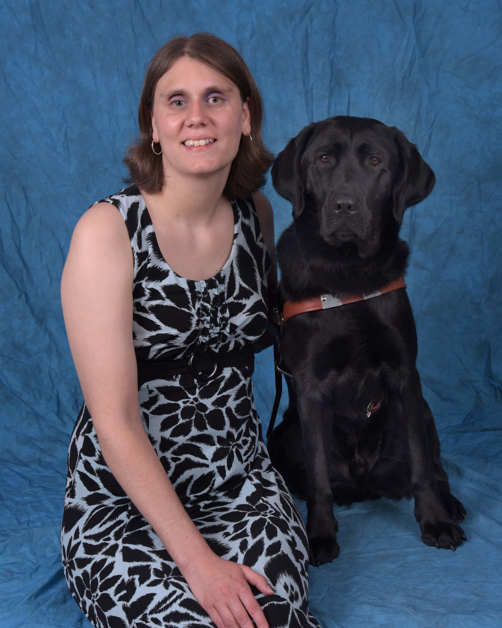 Graduation photo of July graduate Cheryl and guide dog Night