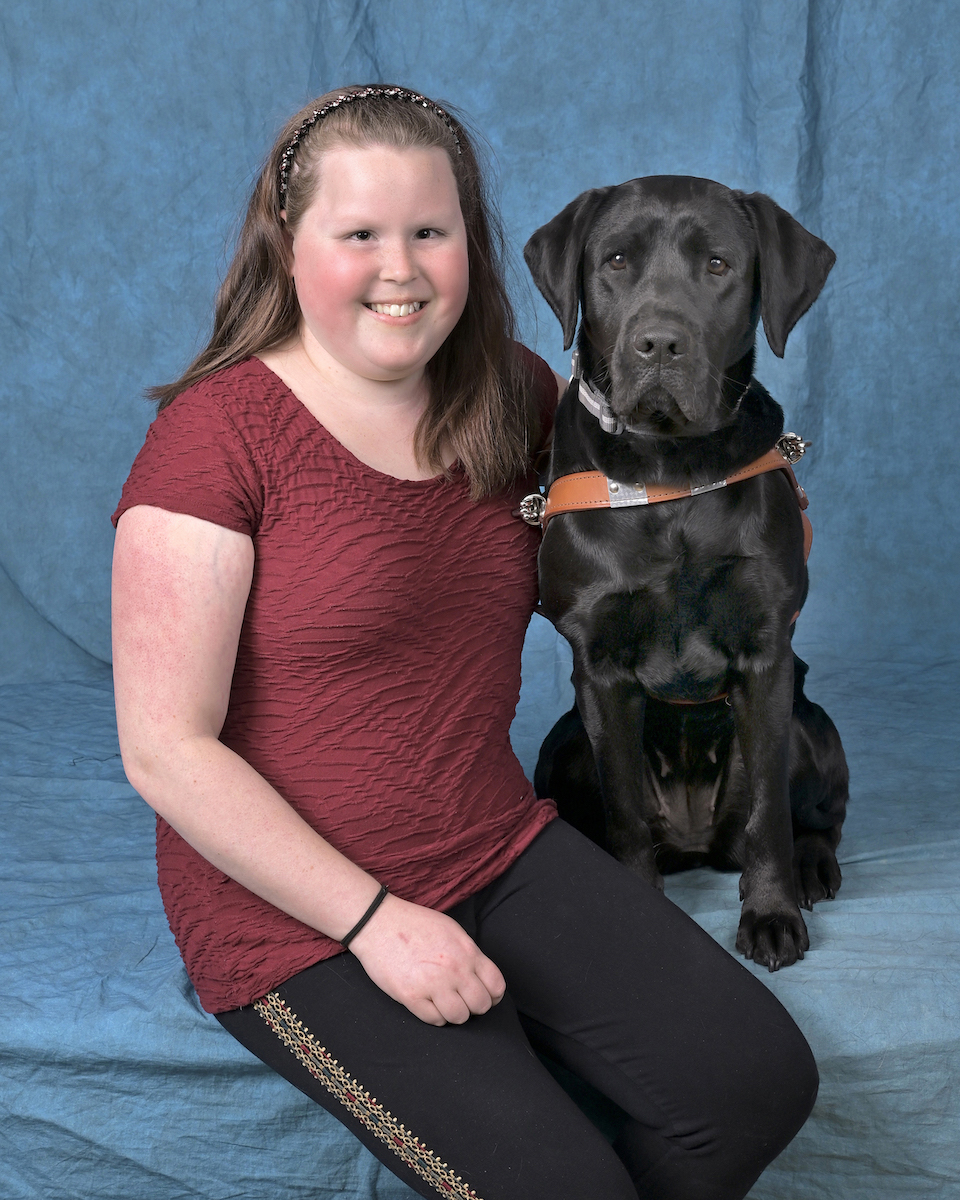 Graduate Calle and black Lab guide dog Teal