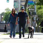 June graduate Dave and guide dog Denver walking down a sidewalk during a training session