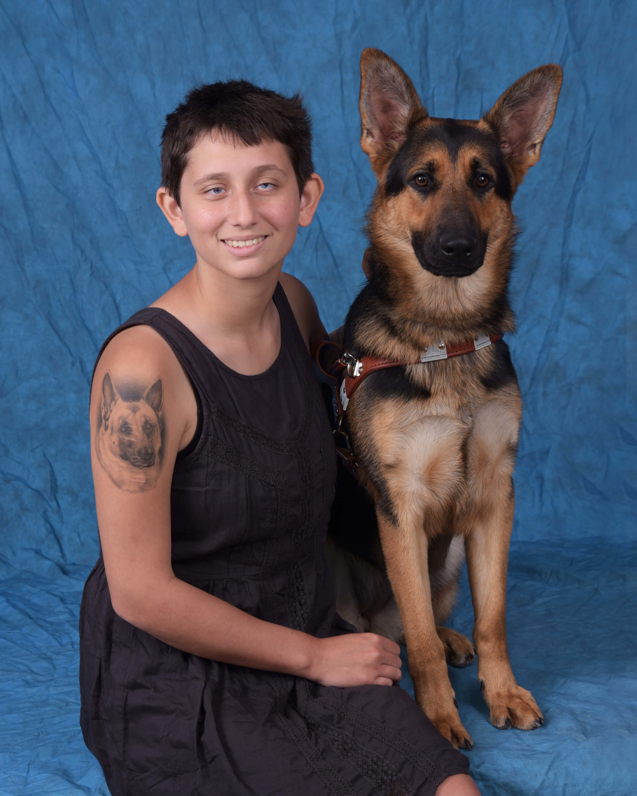 Graduation photo of July graduate Emma and guide dog Holly