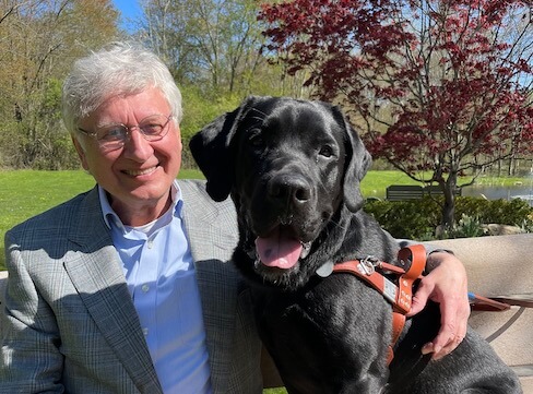 Graduate Gero and guide dog Gilbert