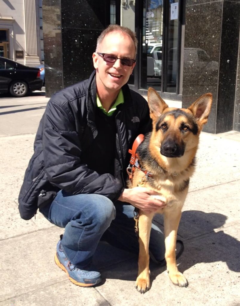 Guiding Eyes assistant director of training Graham Buck with German shepherd Patton