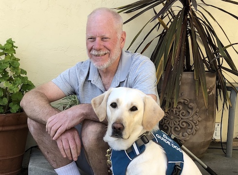 Graduate Ivor and yellow Lab guide dog Tabitha