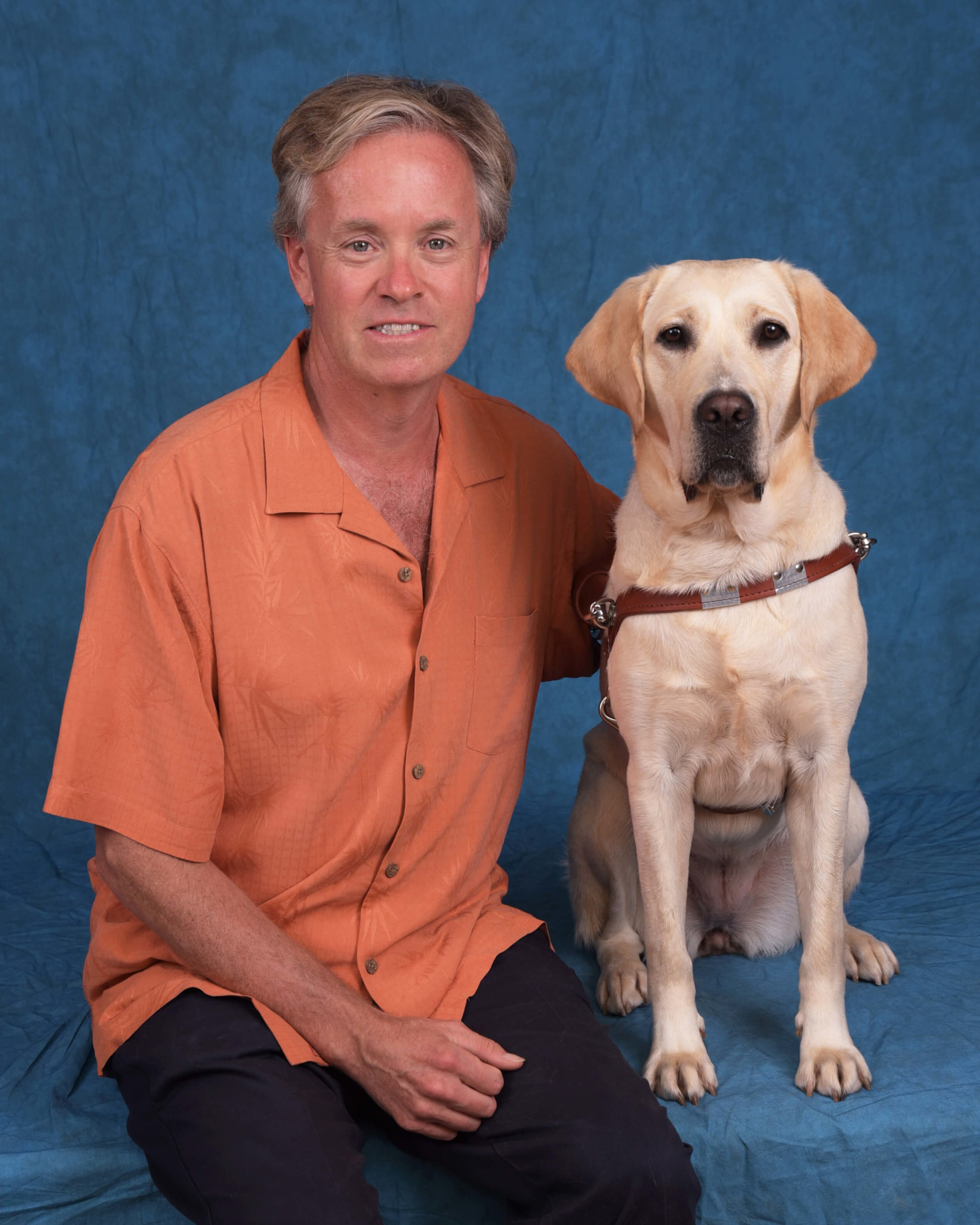 Graduate John and guide dog Merion
