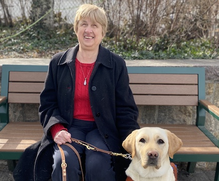 Graduate Janet and yellow Lab guide Madison