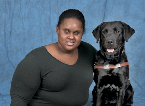 Graduate Jasmin and black Lab guide Osa