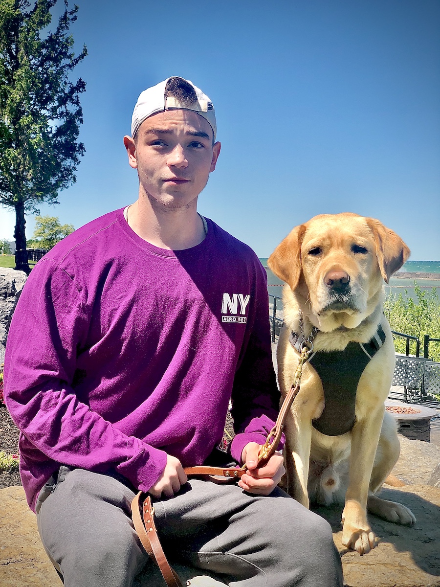 Graduate Jayson and yellow Lab guide dog Oxford