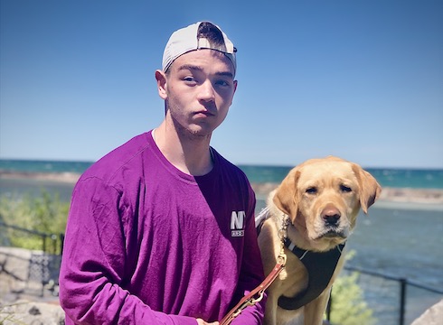 Graduate Jayson and yellow Lab guide dog Oxford