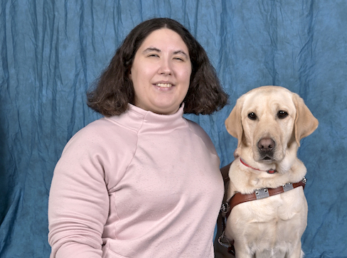Graduate Joelle and yellow guide dog Coconut