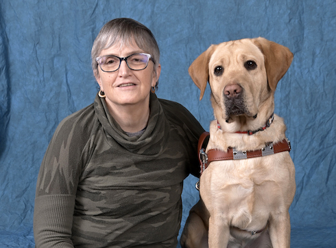 graduate Kerri and yellow lab guide dog Buffy