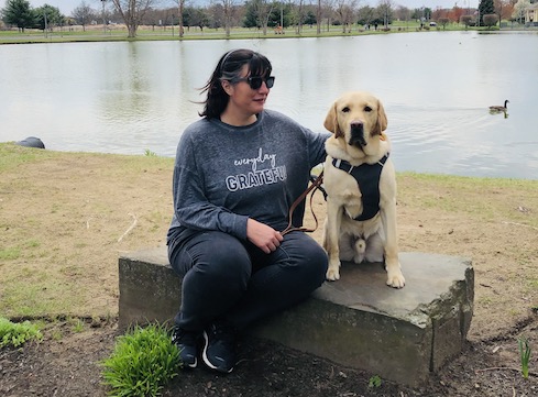 Kate and Icarus at a pond