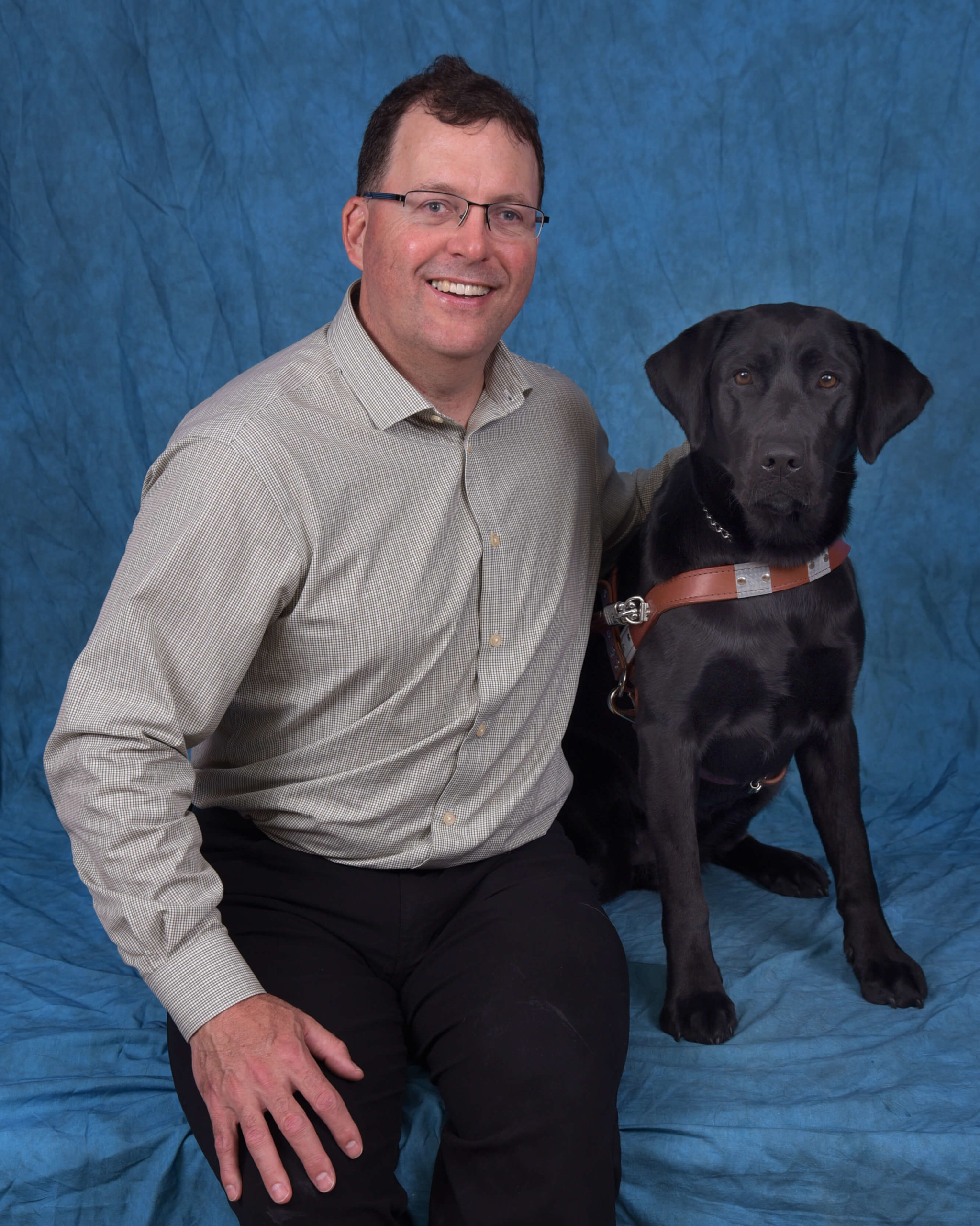 Graduation photo of July graduate Lance and guide dog Saki