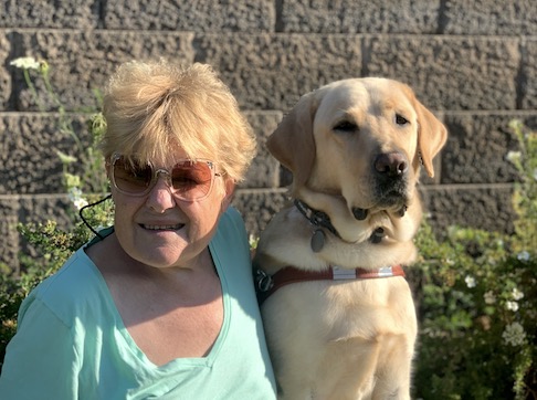 Graduate Laura and yellow Lab guide dog Pacer