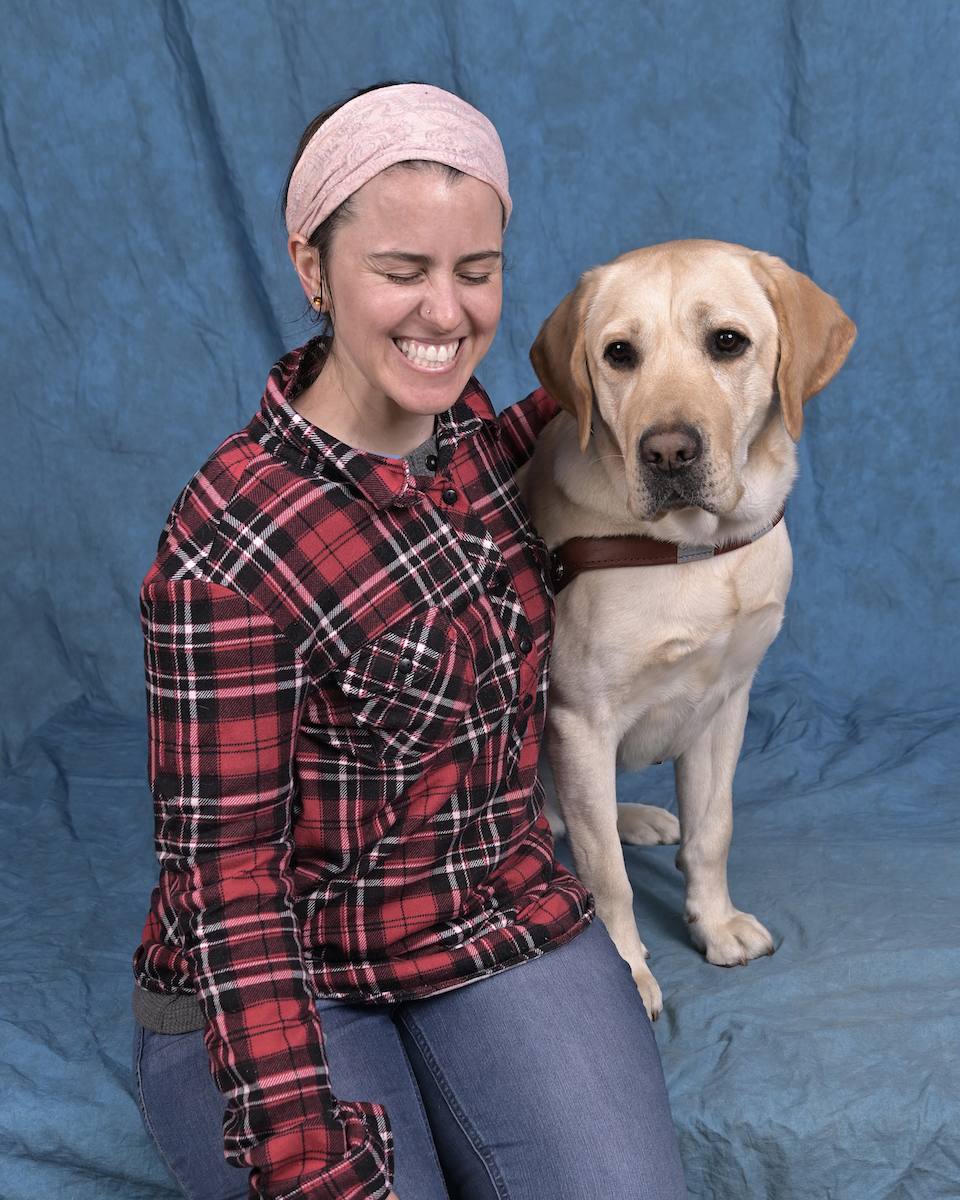 Graduate Lauren and yellow Lab guide dog Blanco