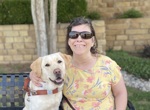 Graduate Lu Ann and yellow Lab guide dog Jaedah