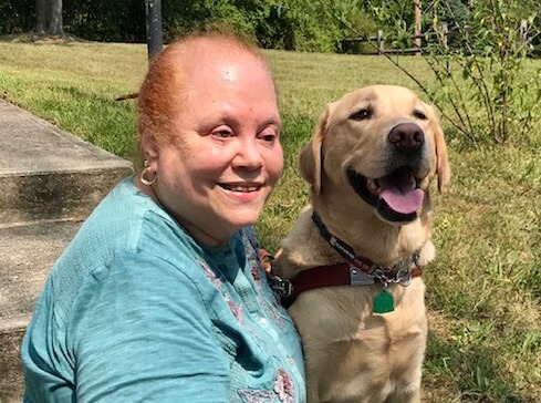 Margaret & guide Anderson pose with big smiles