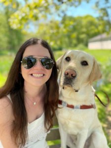 Graduate Marin happily shares a photo with her 1st guide dog Kegan