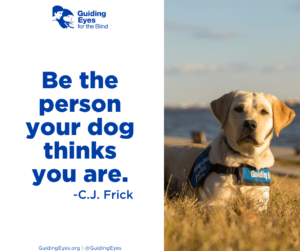 Fay, a yellow Labrador Retriever, lays in the grass beside the Potomac River while wearing her blue Guiding Eyes training vest. The graphic includes the quote: “Be the person your dog thinks you are.”―C.J. Frick