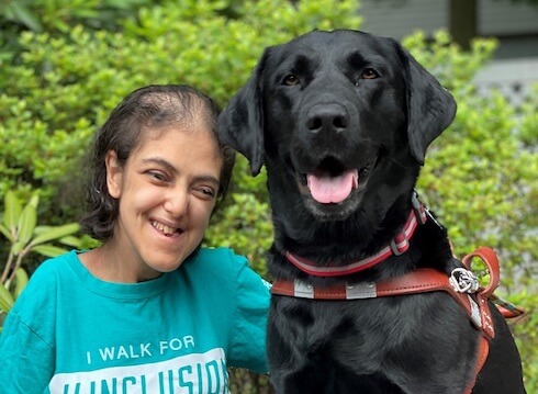 Graduate Nesma and guide dog Radar