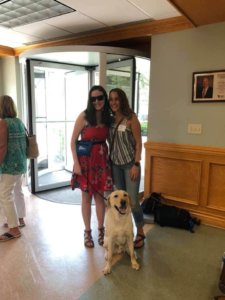 Nicole poses for a photo with graduate team Kate Franklin and Bernard after their graduation ceremony in Alumni Hall.
