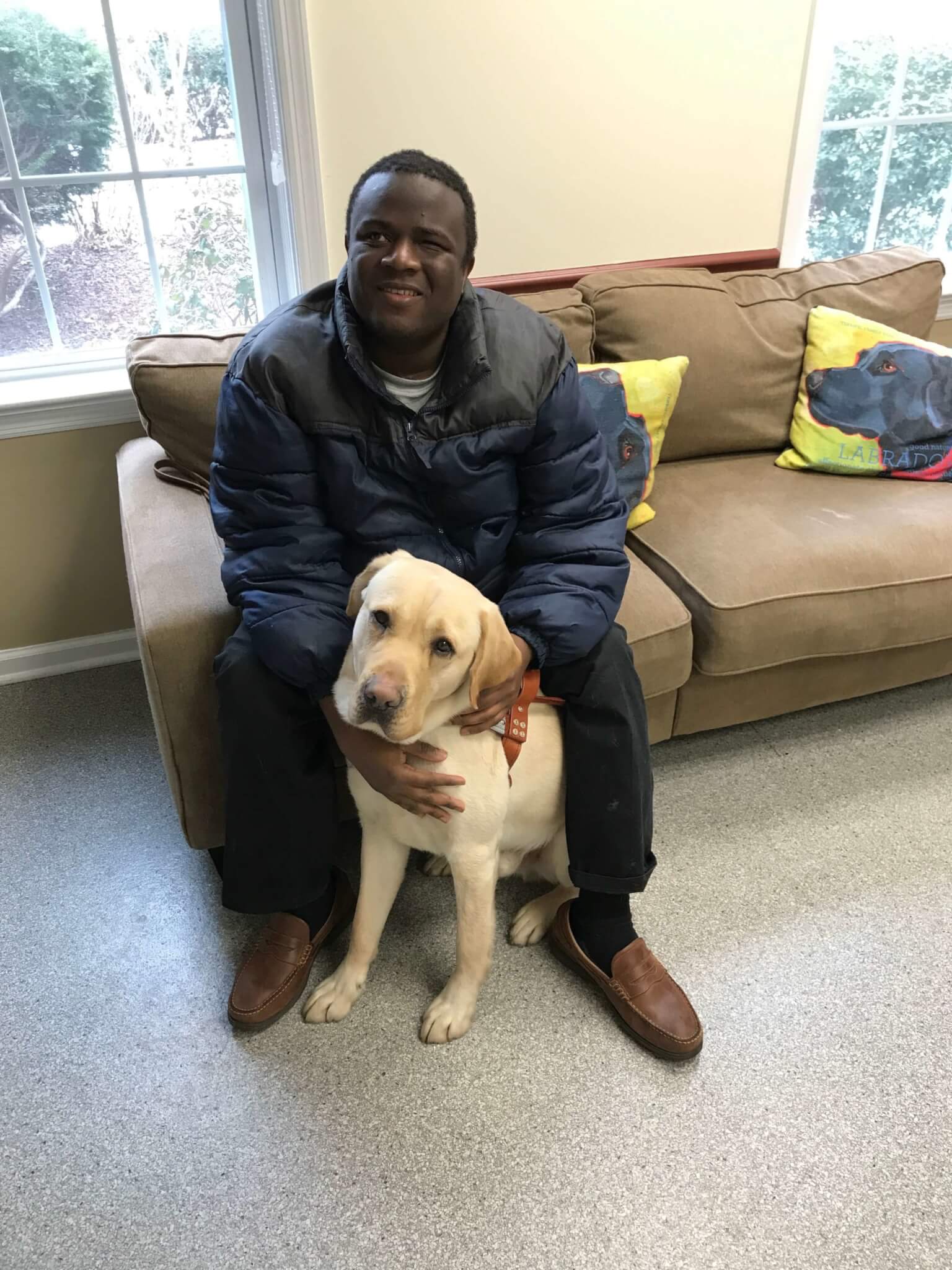 Graduate Osman Koroma & His Guide Dog, Yellow Lab Gadget