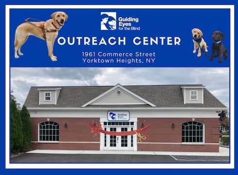 Outreach center grand opening - blue banner with guide and pups