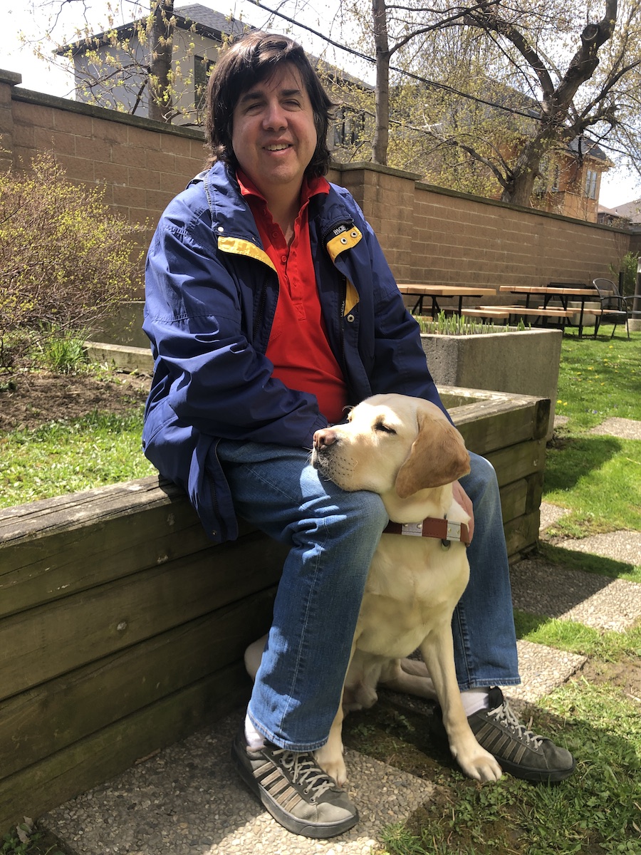 Graduate Paul and yellow Lab guide dog Bo