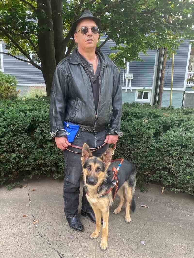 Graduate Paul and German Shepherd guide dog Kazzy