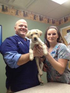 Janice poses with for a picture at Dr. Flowers' veterinary practice in Maine