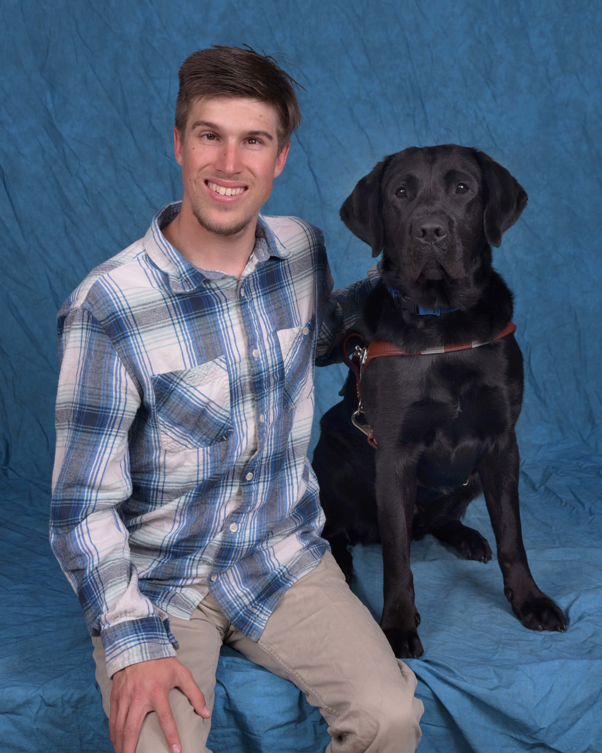 Grad Rory and guide dog Jeeter