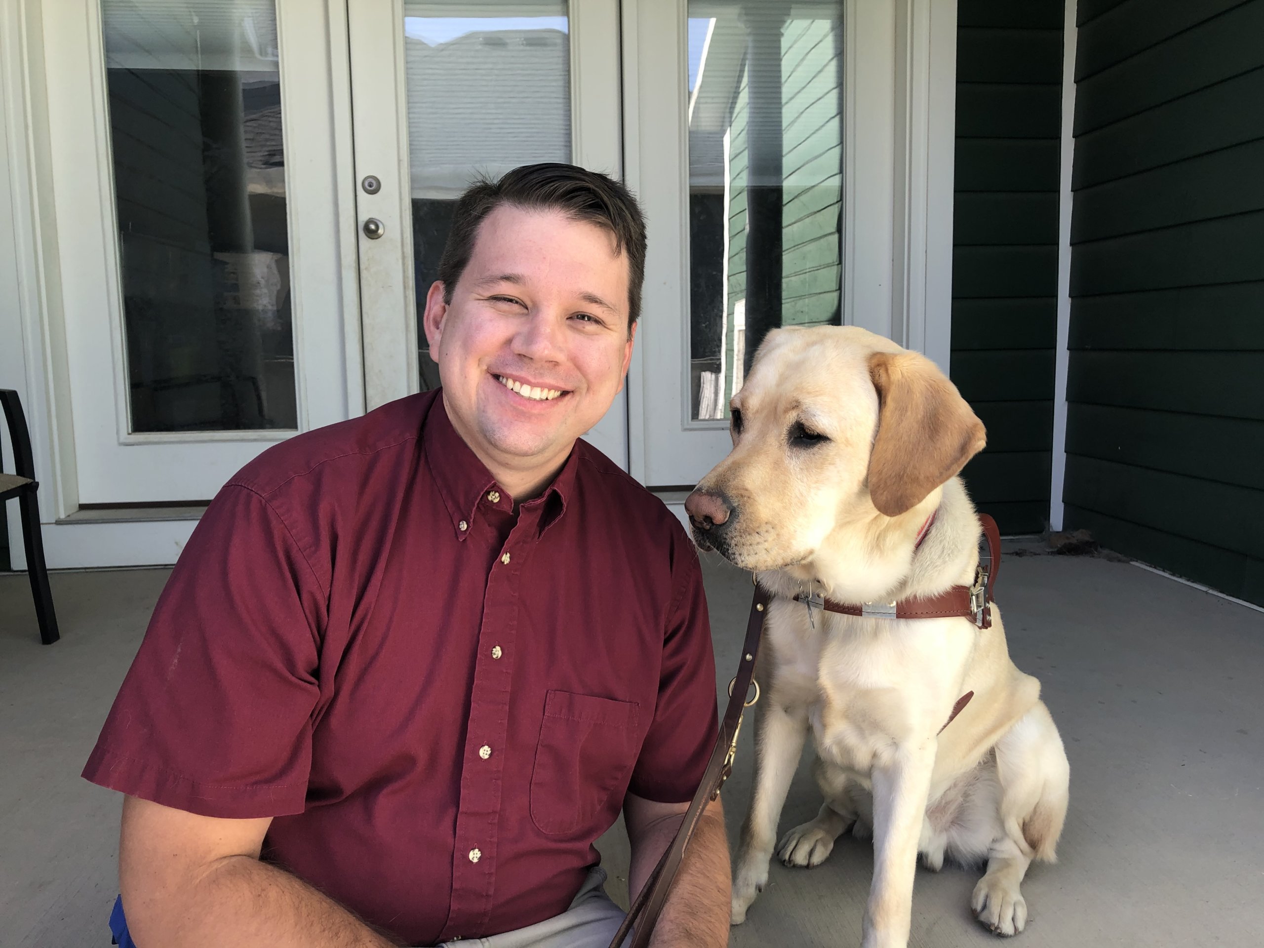 Graduate Ryan and guide dog Levi take a break from training